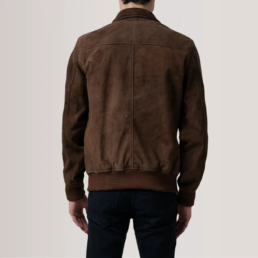 Brown suede jacket worn by a person on a plain background