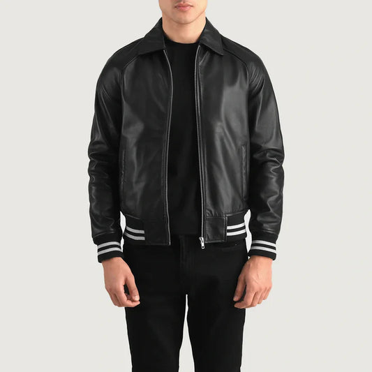 Person wearing a black leather jacket with white stripes on a light gray background