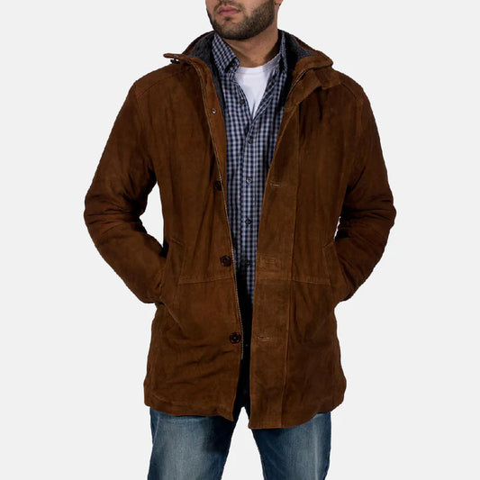 Man wearing a brown hooded jacket over a checkered shirt on a white background