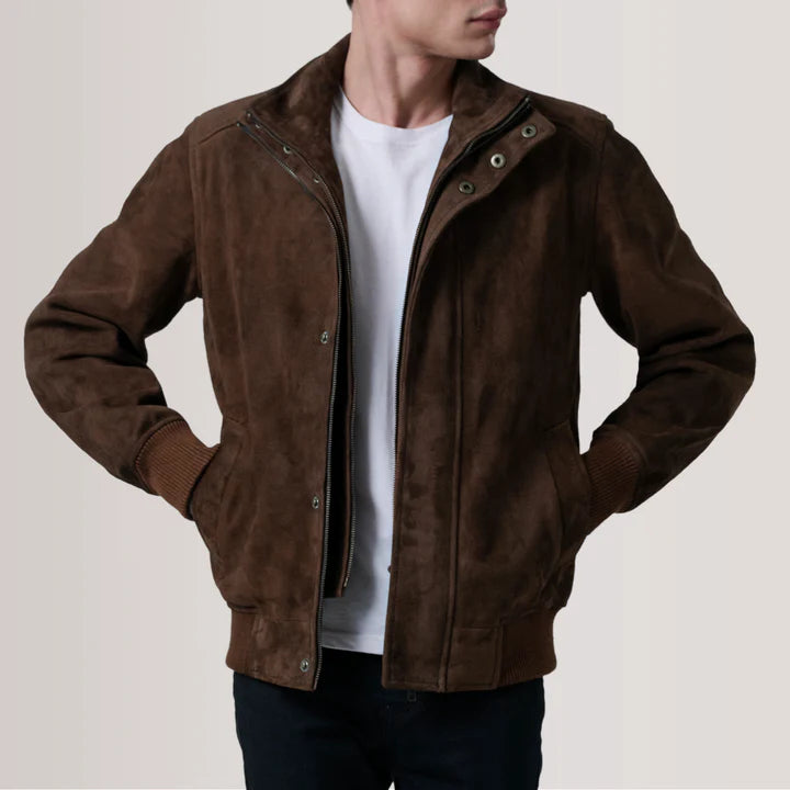 Brown suede jacket worn by a person on a plain background
