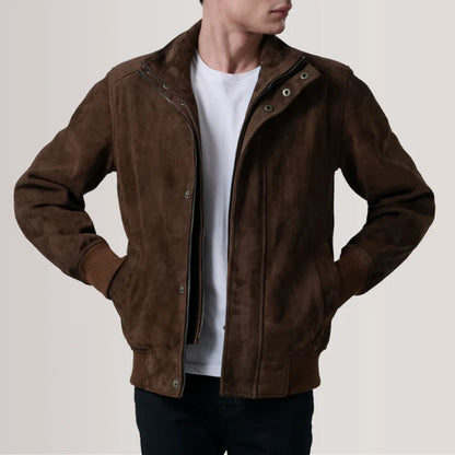 Brown suede jacket worn by a person on a plain background