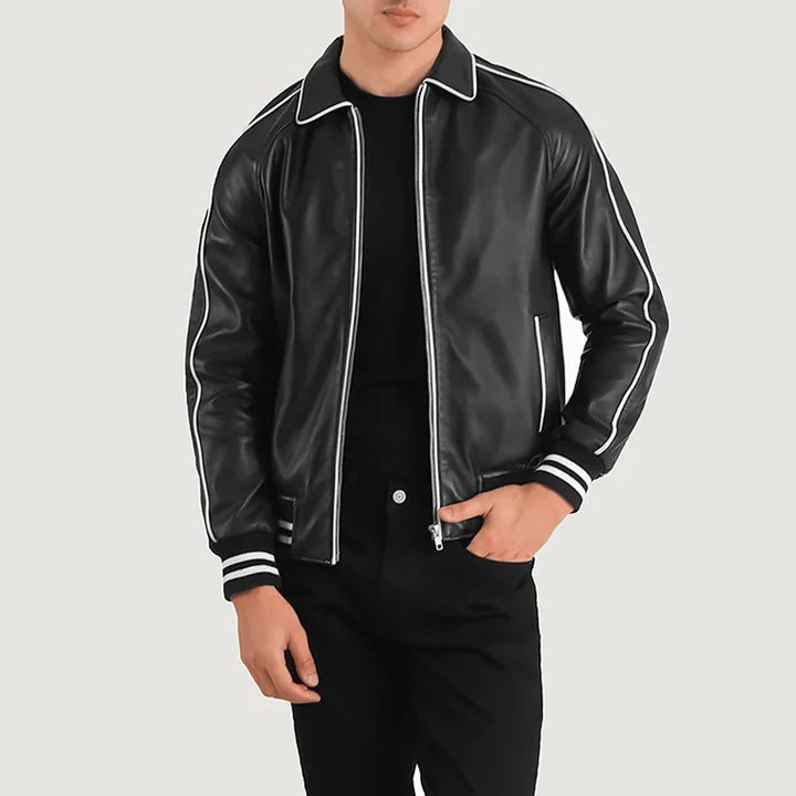 Black leather jacket with white piping worn by a person on a light gray background