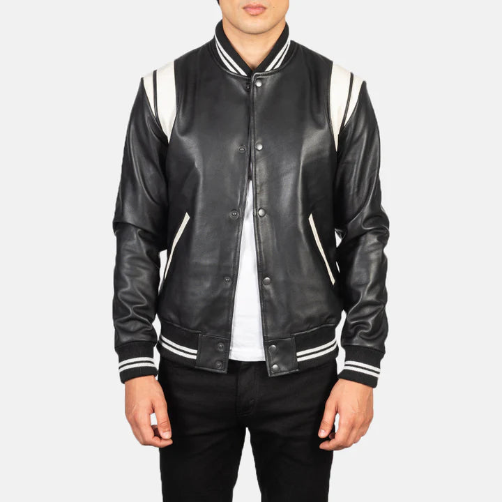 Black leather varsity jacket with white accents on a plain background
