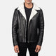 Black leather jacket with white fur lining worn by a person on a white background