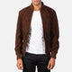 Brown suede jacket worn by a person on a white background