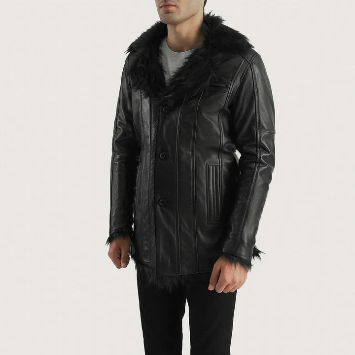 Man wearing a black leather jacket with fur trim on a white background
