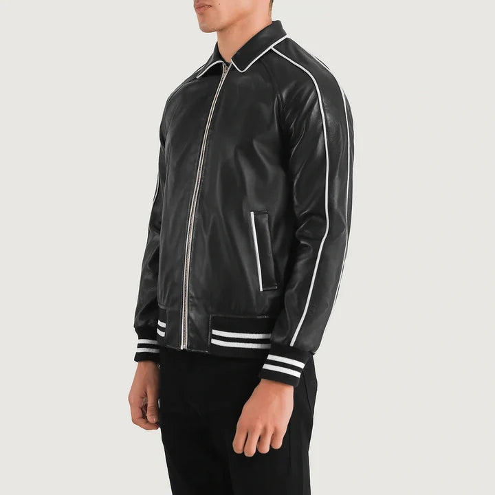 Black leather jacket with white piping on a gray background