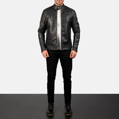 Person wearing a black leather jacket and pants on a plain background