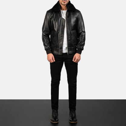 Person wearing a black leather jacket and pants on a white background