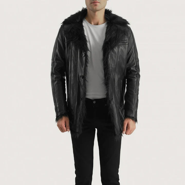 Man wearing a black leather jacket with fur hood on a white background