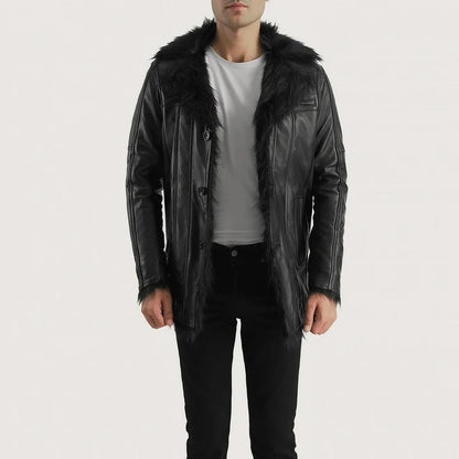 Man wearing a black leather jacket with fur hood on a white background