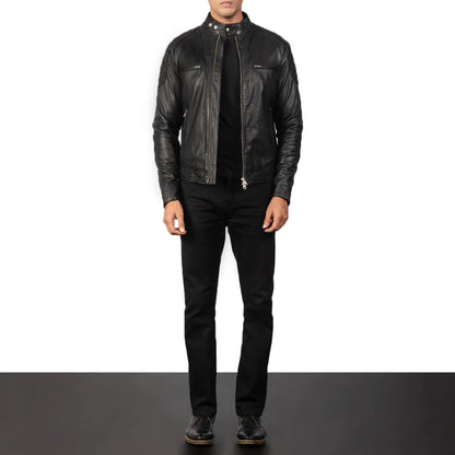 Person wearing a black leather jacket and pants on a white background