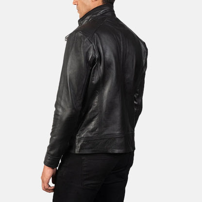 Black leather jacket worn by a person on a white background