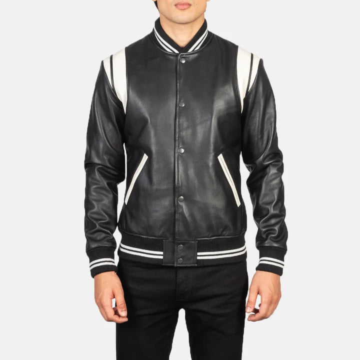 Black leather varsity jacket with white accents on a plain background