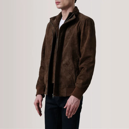 Man wearing a brown jacket on a plain background