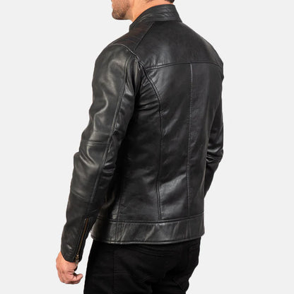 Black leather jacket worn by a person on a white background