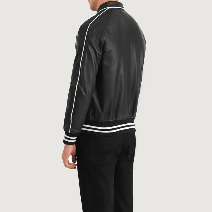 Person wearing a black tracksuit with white stripes on a light gray background