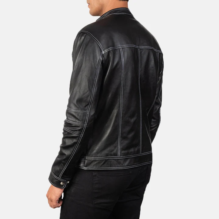 Black leather jacket worn by a person on a white background