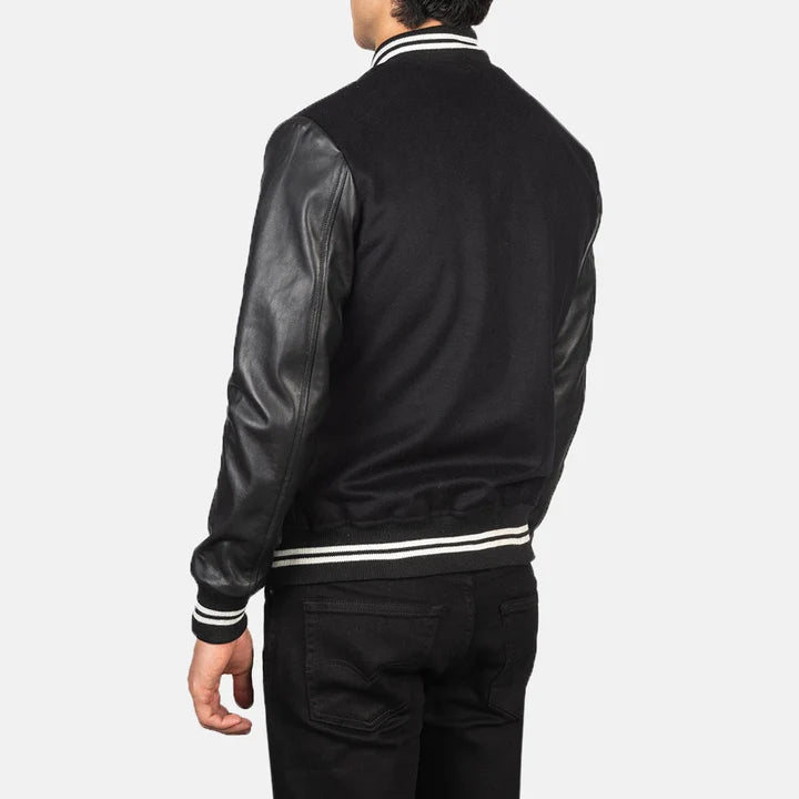 Black leather bomber jacket with white stripes on a plain background