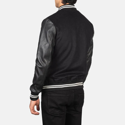 Black leather bomber jacket with white stripes on a plain background