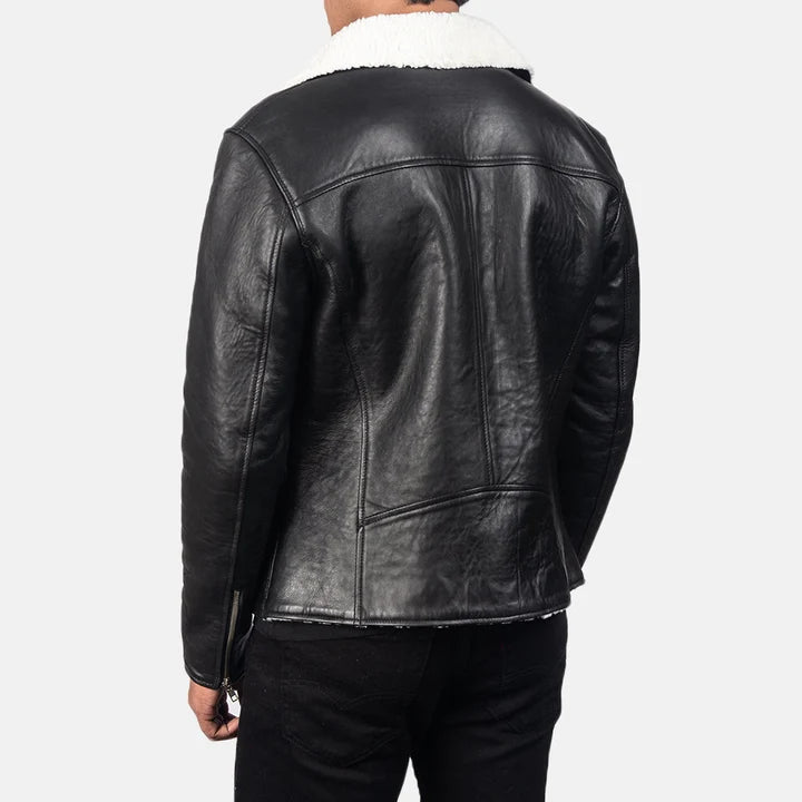 Black leather jacket with white fur lining on a plain background