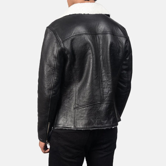 Black leather jacket with white fur lining on a plain background