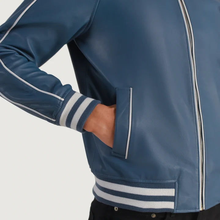 Blue jacket with white stripes on sleeves and collar against a gray background