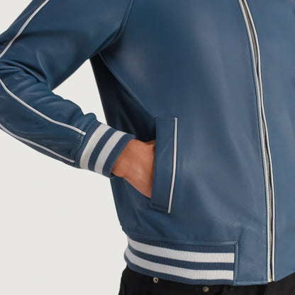 Blue jacket with white stripes on sleeves and collar against a gray background