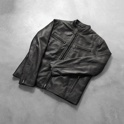Black leather jacket on a gray background