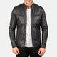 Black leather jacket worn by a person on a white background
