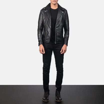 Person wearing a black leather jacket, black shirt, and black pants on a white background