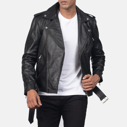 Person wearing a black leather jacket over a white shirt on a light gray background